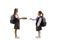 Schoolgirl giving books to another schoolgirl