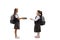 Schoolgirl giving books to a happy girl in a school uniform