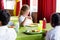 Schoolgirl having food with classmates