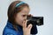 Schoolgirl with historic photo camera