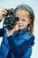 Schoolgirl with historic photo camera
