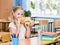 Schoolgirl holding an apple and fast food