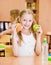 Schoolgirl holding an apple and fast food