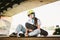 Schoolgirl after lessons at skateboarding practice in outdoor skate park. Stylish and beautiful caucasian girl with skateboard on