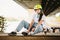 Schoolgirl after lessons at skateboarding practice in outdoor skate park. Stylish and beautiful caucasian girl with skateboard on