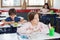 Schoolgirl Looking Away While Drawing In Classroom