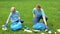 Schoolgirl and mother collecting rubbish in park, earth pollution, ecosystem