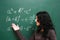 Schoolgirl near the blackboard