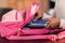 Schoolgirl packing backpack and preparing for school