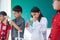 Schoolgirl pouring chemical liquid in classroom