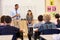 Schoolgirl presenting to her elementary school classmates