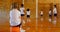 Schoolgirl sitting on basketball in basketball court at school 4k
