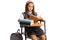 Schoolgirl sitting in a school chair and reading a book