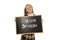 Schoolgirl smiling happy and cheerful holding and showing small blackboard with text I learn Spanish