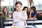 Schoolgirl Standing Arms Crossed In Classroom