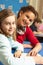 Schoolgirl Studying In Classroom With Teacher