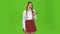 Schoolgirl takes off her glasses and yawns. Green screen