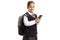 Schoolgirl in a uniform with a backpack holding a smartphone