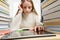 A schoolgirl uses a tablet while learning.