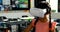 Schoolgirl using virtual reality headset in classroom 4k
