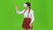 Schoolgirl with virtual reality glasses. Green screen