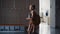 Schoolgirl walking holding books in empty hall alone. Pupil passing classrooms.