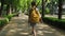 Schoolgirl walks through the park to school in morning. Back to school education