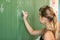 Schoolgirl Writing on the Blackboard