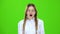 Schoolgirl yawns . Green screen