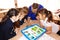 Schoolgirls in class are sitting at a desk