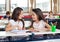 Schoolgirls Looking At Each Other In Classroom