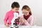 Schoolgirls with modern microscope