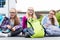 Schoolgirls sitting in schoolyard at school