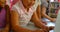 Schoolgirls studying together on laptop at table in school library 4k