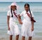 Schoolgirls in uniform hand in hand