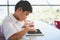 Schoolkid using digital tablet in classroom