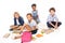 Schoolkids sitting near books and apples