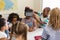 Schoolkids using virtual reality headset in classroom