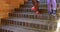 Schoolkids walking down staircase of elementary school 4k