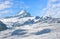 Schreckhorn mountain in winter, blue sky with clouds