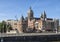 The Schreierstoren with spires and bell tower of the Basilica of Saint Nicholas in the background, Amsterdam, The Netherlands