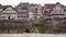 Schwabisch Hall, Germany - May 5, 2019: Three little boys friends sit on the canal and chat near water against a