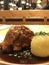 Schweinshaxe, traditional Bavarian-style pork knuckle with potato dumplings