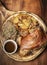 SCHWEINSHAXE traditional german pork knuckle with sauerkraut and potatoes meal