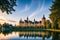The Schwerin castle at sunset reflecting in water made with Generative AI