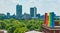 Science Central rainbow smokestacks with distant downtown Fort Wayne skyscrapers aerial panorama