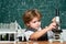 The Science Classroom. Little kid scientist earning chemistry in school lab. Biology lesson. Kid is learning in class on