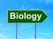 Science concept: Biology on road sign background