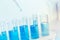 Science Glass test tube blue color in research lab
