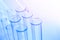 Science laboratory test blue tubes, macro flask equipment. Chemical dropper